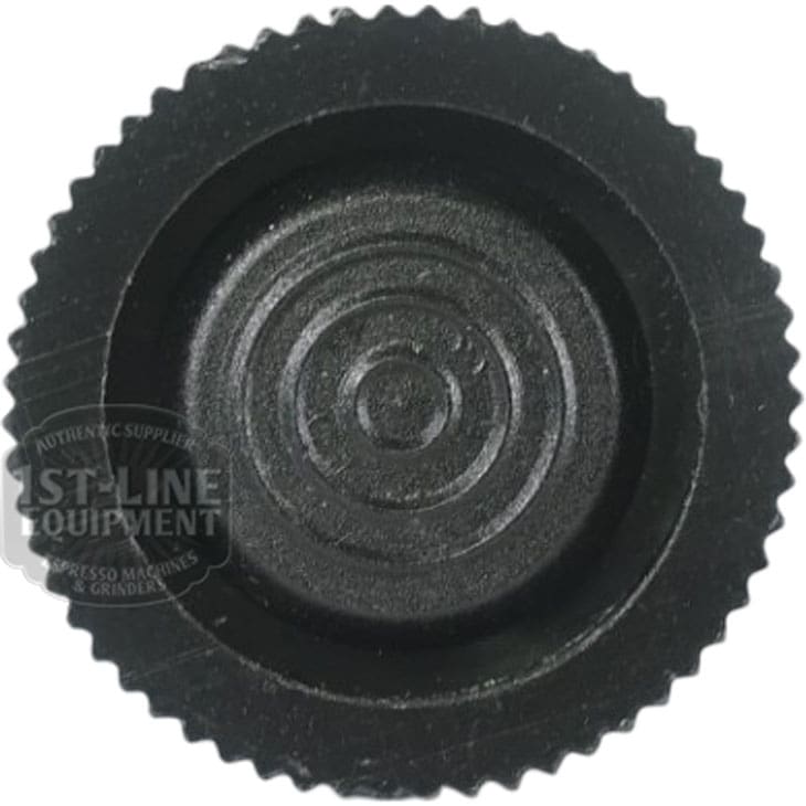 Close-up of the FOOT M10: a black, round, ridged plastic knob with concentric circles on its flat surface, viewed from above. A faint, partially visible logo appears on the left side. © 2025 1st-line.com