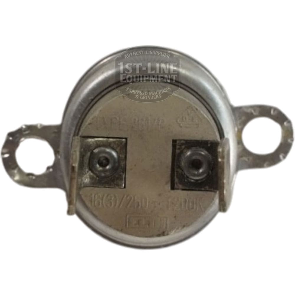 A close-up of the Thermostat 165 Degree C shows its round metal body, two screw terminals, side mounting tabs, and a front plate labeled with its 165°C rating and other technical specifications. © 2025 1st-line.com