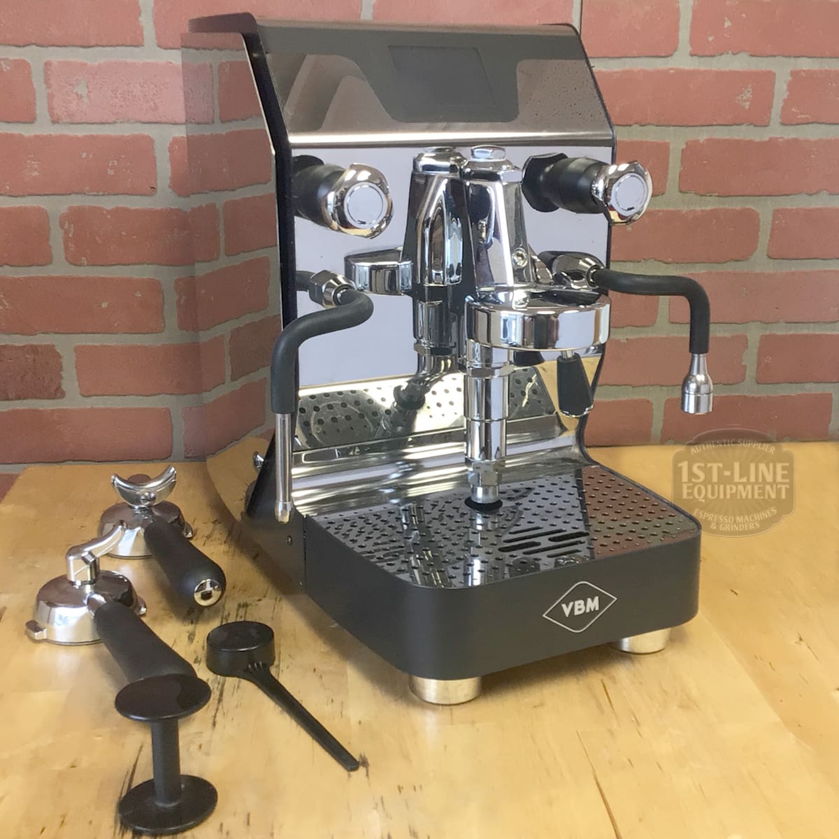 A SIDEWALK SALE - VBM Super Digital DUAL PROFILER Dual Boiler Espresso Machine (used) (E111) sits on a wooden table, surrounded by coffee accessories—ready for your Sidewalk Sale pickup. © 2025 1st-line.com