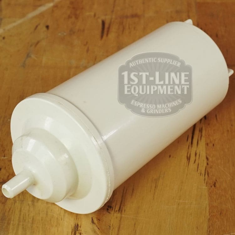 A LIKE NEW - Elektra Verve Dual Boiler Espresso Machine (C104) water filter cartridge, white and cylindrical, rests on a wooden surface with the 1st-Line Equipment logo and text partly visible. © 2025 1st-line.com