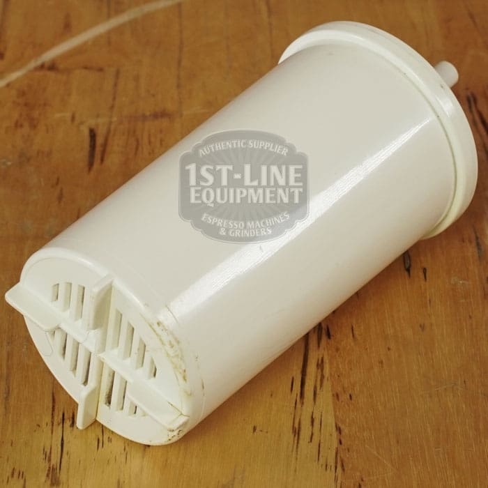 A white cylindrical water filter cartridge with a vented end sits on wood, slightly worn. It’s perfect for the LIKE NEW - Elektra Verve Dual Boiler Espresso Machine (C104). The “1st-Line Equipment” watermark appears on the image. © 2025 1st-line.com