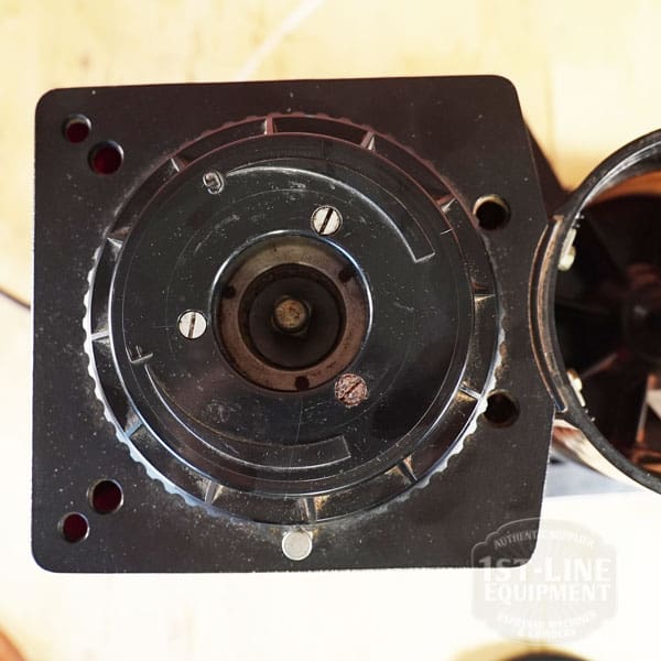 Top view of the SIDEWALK SALE - Cunill Doser Grinder (E012) burr mechanism, highlighting its circular grinding chamber and metal screws—branding partially visible, ideal for your next Sidewalk Sale showcase. © 2025 1st-line.com