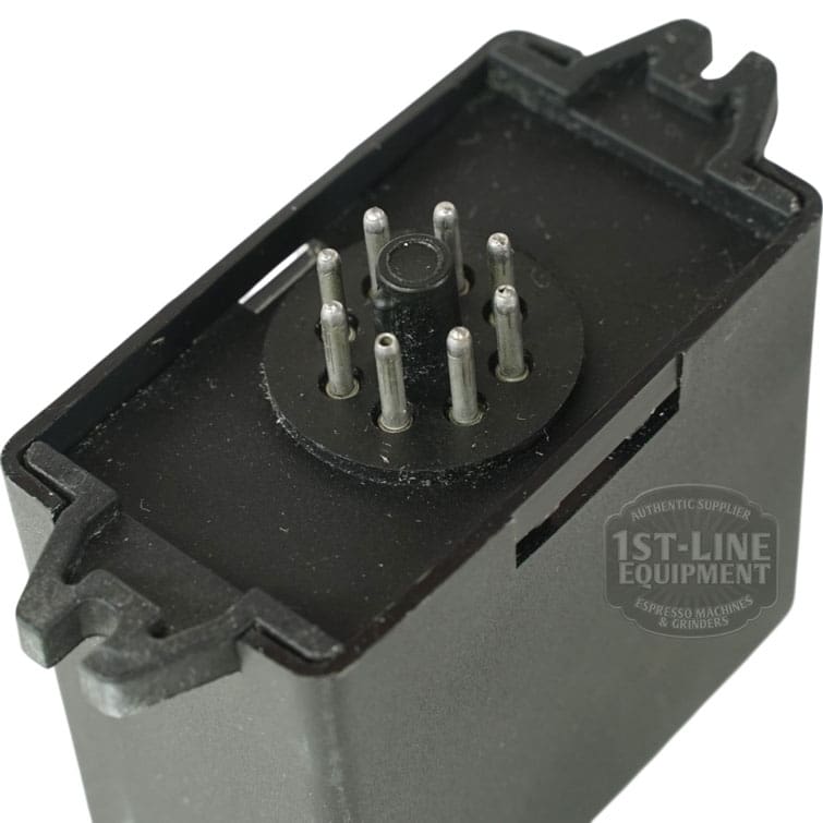 Close-up of a black rectangular Gicar RL30/1E/8 9.1.00.00 Water Level Regulator 220V, featuring eight metal prongs in a circular layout at one end and the 1st-Line Equipment logo visible on the device. © 2025 1st-line.com