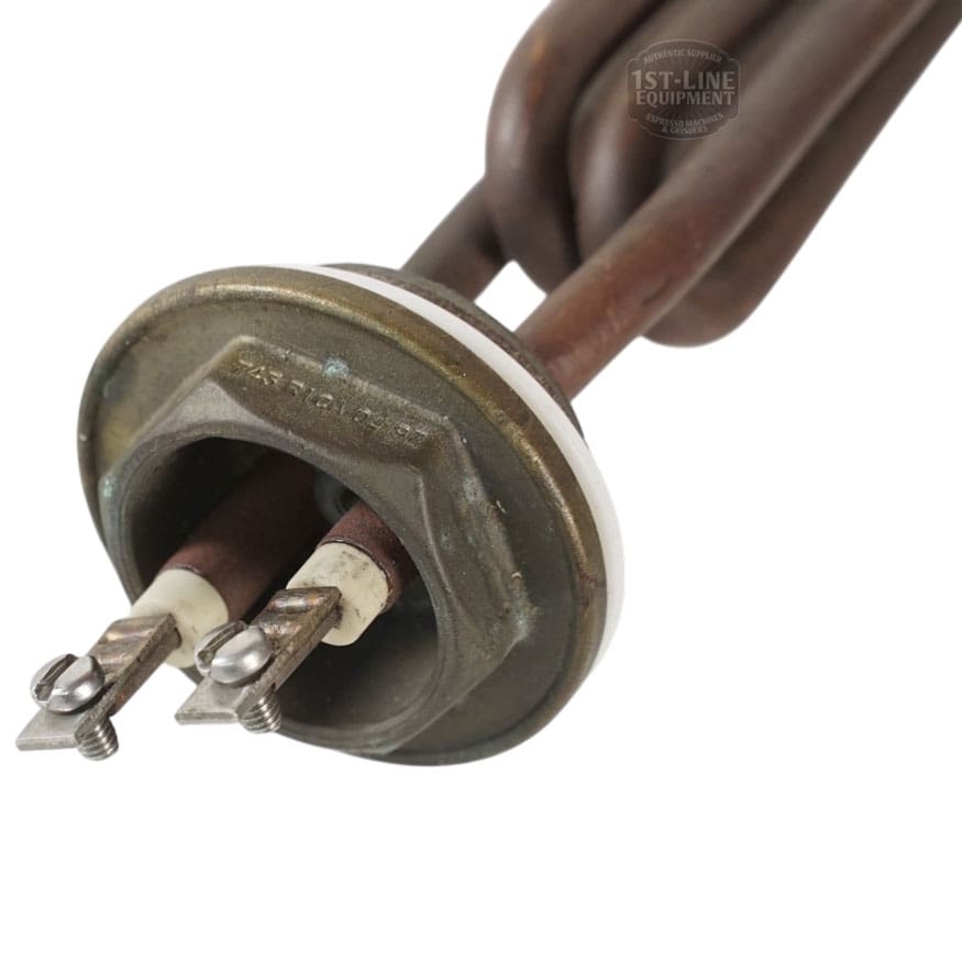 Close-up of the Heating Element 110V 1800W featuring two screw terminals and ceramic insulators, designed for appliances like coffee machines or water heaters. The circular metal construction ensures efficient heating. © 2025 1st-line.com