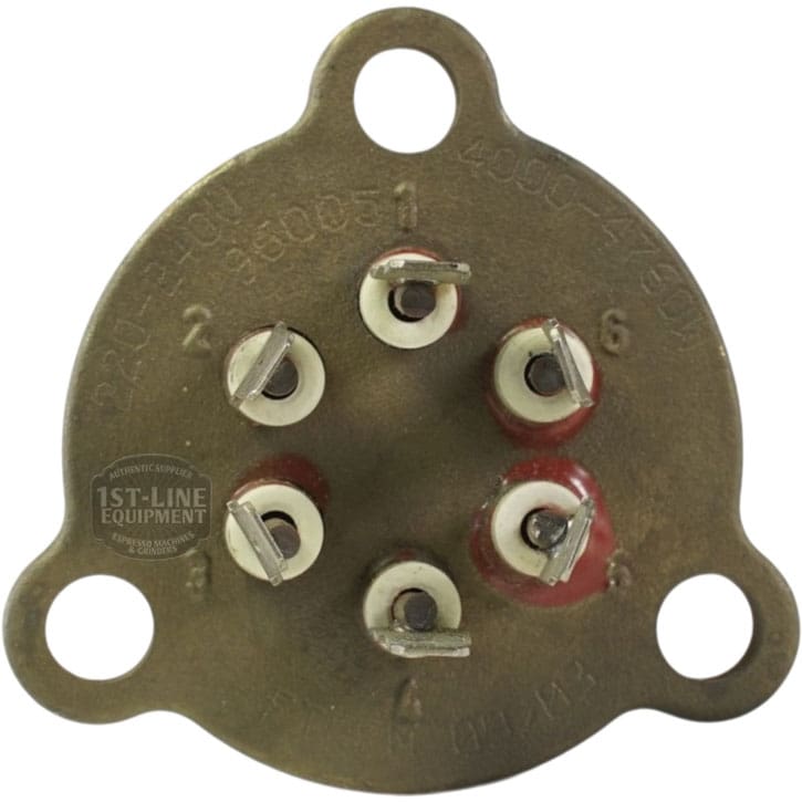 Close-up of the Nuova Ricambi 310450 220V 4000W Heating Elements vintage round metal connector with six numbered screw terminals and two mounting holes. Slightly worn, this part is used for 220V heating elements. © 2025 1st-line.com