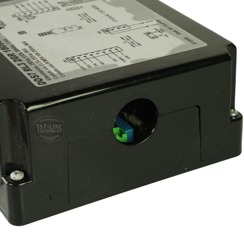 A close-up of a black electronic control box labeled Giemme 18090084 Cod. 01.13.0159 Brain Unit, showing a diagram on top and a round cutout revealing green and blue electrical terminals inside. © 2025 1st-line.com