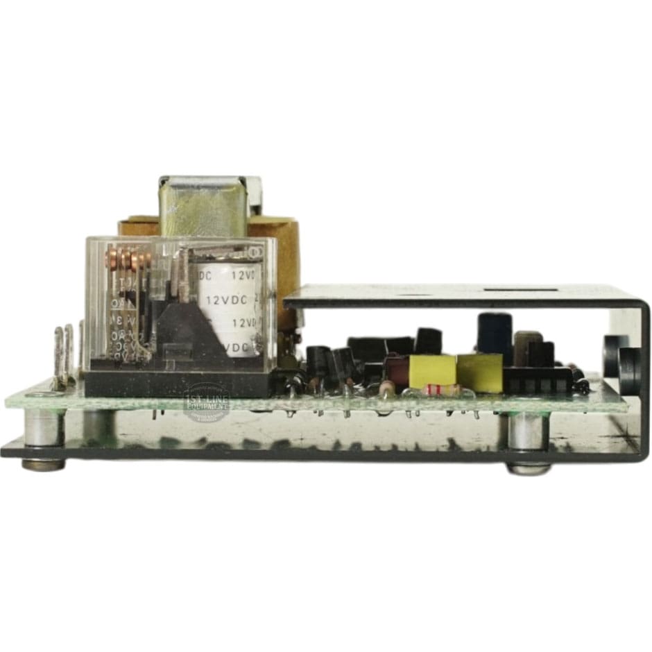 A close-up of a Cecilware L296A Liquid Level Control LCW-S1399-120 circuit board showing components like a transformer, capacitors, 12VDC relay, and connectors, all mounted on a clear base with metal standoffs. © 2025 1st-line.com