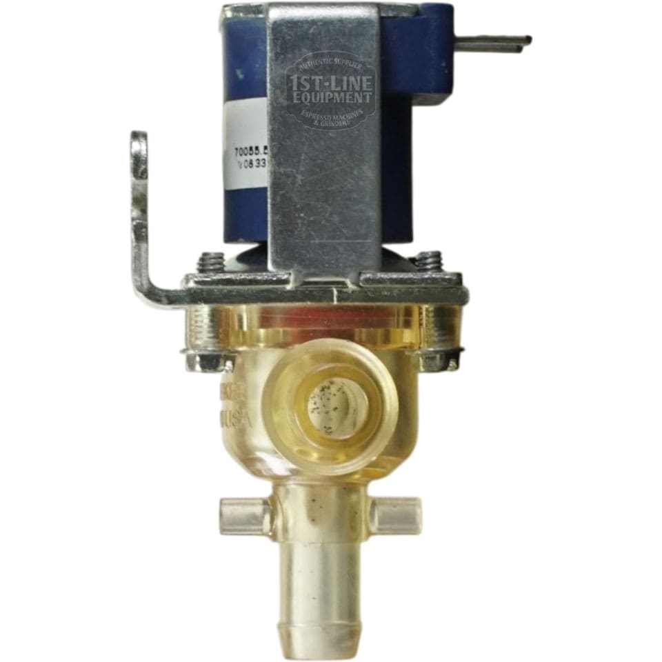 A close-up of the Bunn 27370.0007 Solenoid Valve Assembly - Bypass-Plastic - 120V with a blue electrical coil, mounting bracket, transparent multi-connection valve body, and 1st-Line Equipment label at the top. © 2025 1st-line.com