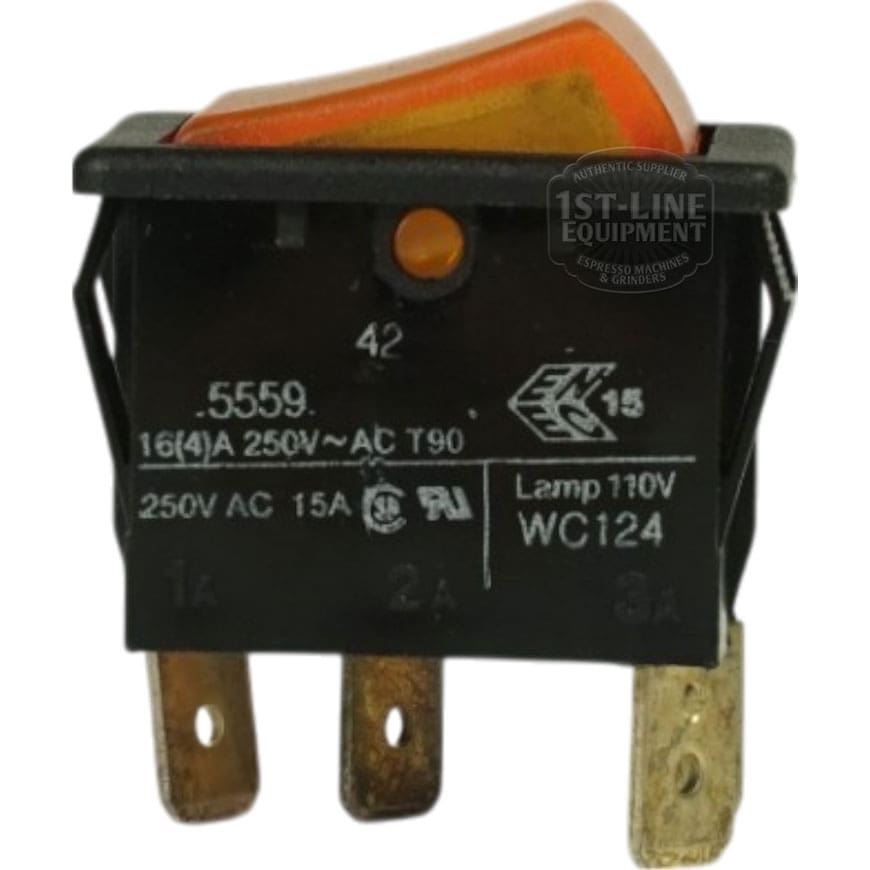 Close-up of a Curtis WC-124 Amber Rocker Hot Water Switch featuring a black and orange design, metal prongs, and white text on the side displaying 250V AC and 15A electrical ratings. © 2025 1st-line.com