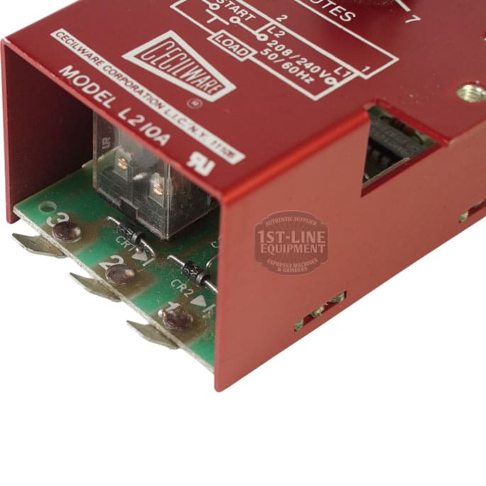 Close-up of a red electrical device labeled “MODEL L210A” by Seco Ware, resembling the Grindmaster Cecilware L201A Timer (208-240V, 50/60Hz, 2-7 min), with green circuit board, terminals, and technical specs in view. © 2025 1st-line.com