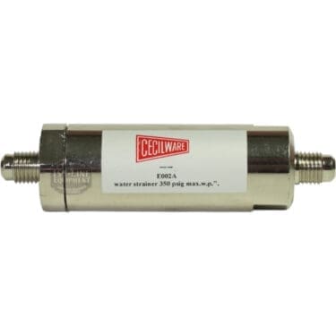 The Grindmaster-Cecilware E002A Water Strainer has a metal cylindrical body, 1/4 flare fittings with threaded connectors on both ends, and a white label marked “E002A water strainer 350 psig max. w.p.”. © 2025 1st-line.com