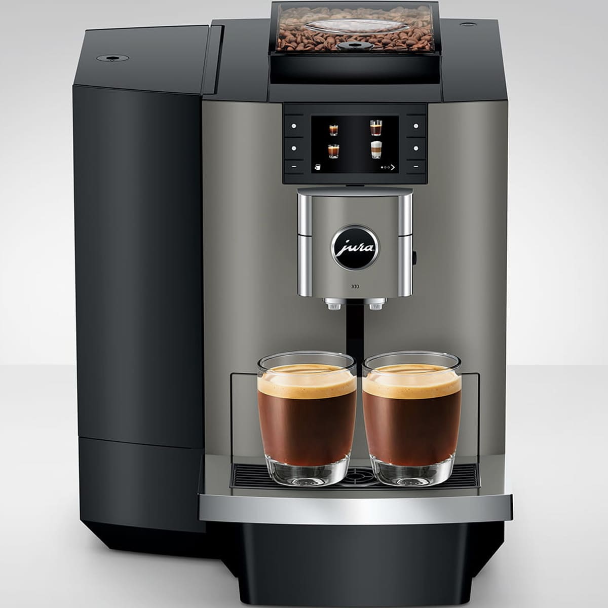The Jura X10 Super-Automatic Espresso Machine features a digital display at the front center and a top compartment showing whole coffee beans, brewing two cups of espresso with sleek, modern style. © 2025 1st-line.com