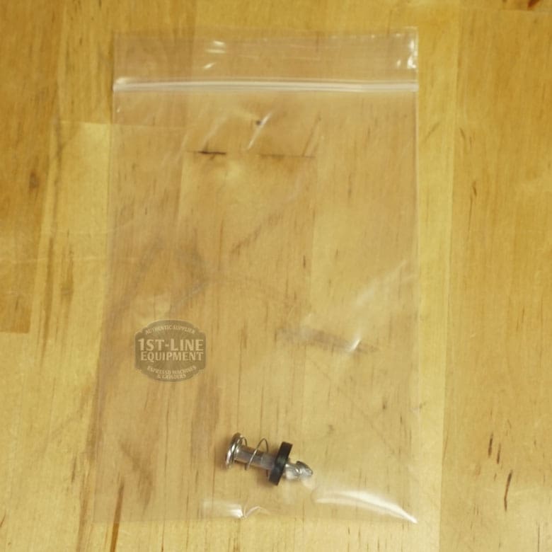 A small metal part with a spring and rubber ring from the Lelit 1000156 External Water Tank Assembly - Small Dent & Scratch (E112) is in a clear resealable bag labeled 1st-Line Equipment on a light wooden surface. © 2025 1st-line.com