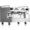 A shiny, stainless steel commercial espresso machine with two group heads, multiple knobs, gauges, and a side steam wand, displaying the Rocket Espresso Milano logo on the front. © 2025 1st-line.com