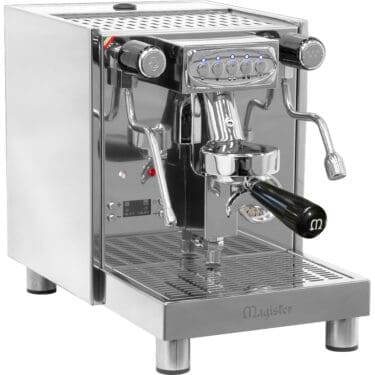 A stainless steel Magister espresso machine with multiple control buttons, steam wands, a portafilter, and a drip tray, designed for making coffee and espresso drinks. © 2025 1st-line.com