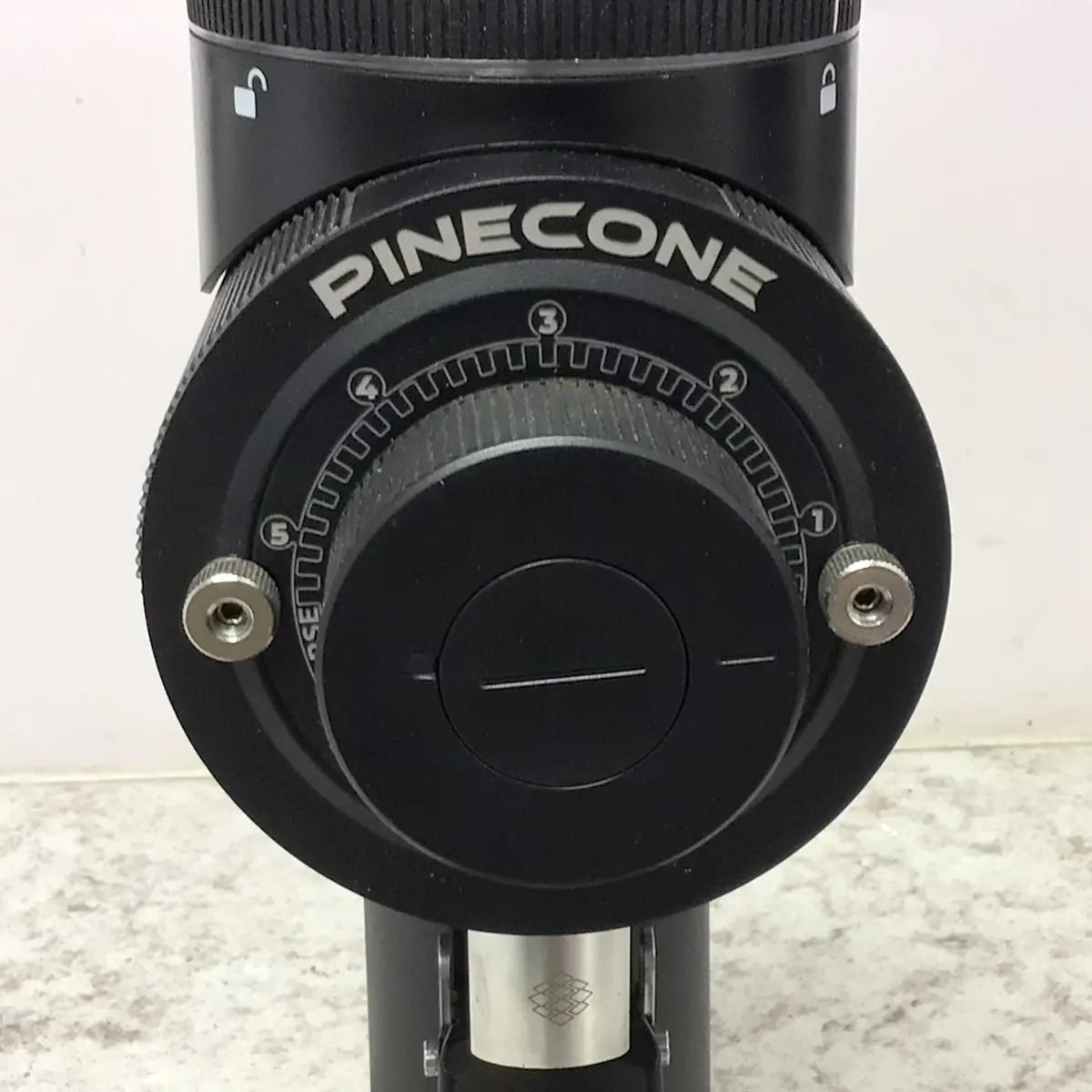 A black camera lens with a dial, echoing the precision of the SIDEWALK SALE Pinecone Pinion All-Purpose Espresso Coffee Grinder (showroom demo). © 2025 1st-line.com
