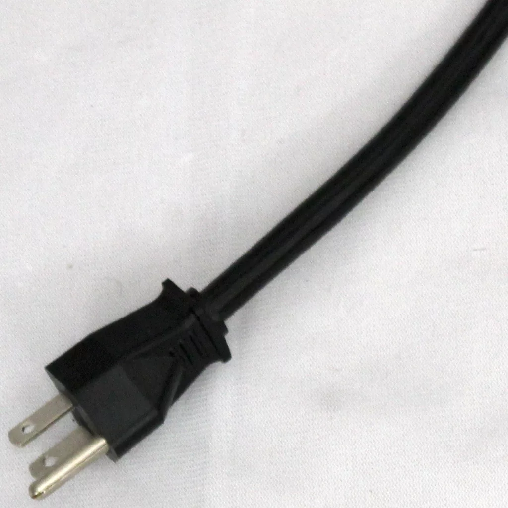 A black electrical power cord with a two-prong plug rests on a white surface. © 2025 1st-line.com