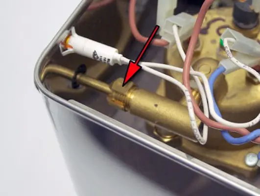 Close-up of a Lelit PL41 Anna espresso machine’s internal components, focusing on the steam valve repair area—a brass pipe connected by wires, with a red arrow highlighting a key part for emphasis. 2025 1st-line.com