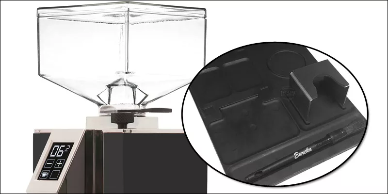 A coffee grinder with a digital display and square transparent hopper is shown on the left. On the right, a black tray with compartments, brush, and holder keeps your grinders and coffee tools organized&mdash;perfect for espresso machine package deals. &copy; 2025 1st-line.com