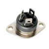 A close-up of a Carimali (96.00843) Triac BTA25-800-BW, featuring a metal thermostat switch with a black plastic base, three flat terminals, and a rectangular metal plate with two screw holes.