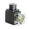 A close-up of a black, box-shaped Carimali (96.05051.00.17) Solenoid Valve 120V with a circular metal mounting plate and spring clip attached to the front.