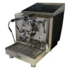 The VBM Lollo Electronic 1 Group HX Espresso Machine - 110V features dual gauges, a portafilter, steam wand, hot water spout, digital display, and sits on a drip tray with the VBM logo on the lower front panel.