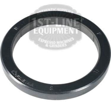 A Faema Portafilter Gasket 74x58x8mm, black and circular with embossed lettering, is shown on a white background with the watermark "1st-Line Equipment Authentic Supplier Espresso Machines & Grinders.
