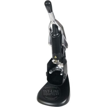 A black manual espresso lever machine with a sturdy base and long vertical handle for hand-pulled shots. Pair it with the Fiorenzato Rotodynamometric Tamper for precision. The base features the 1st-Line Equipment logo.